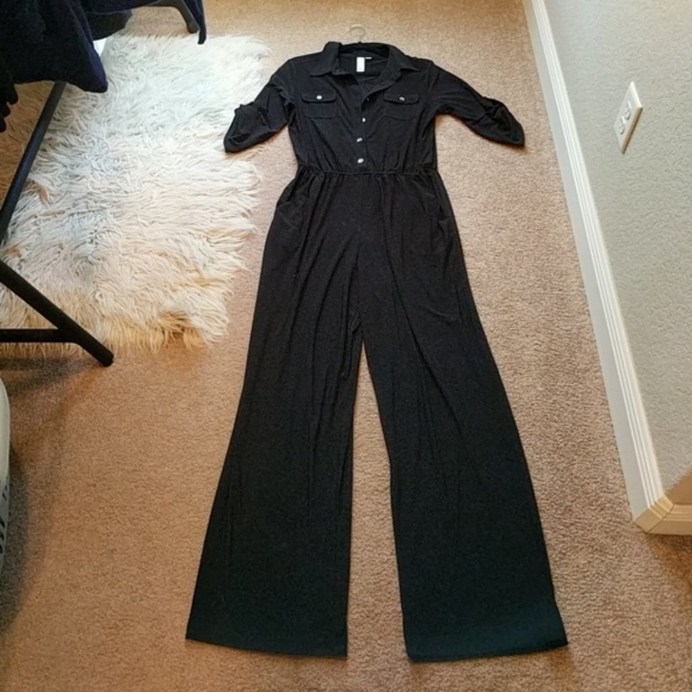 Black jumpsuit with gold zipper